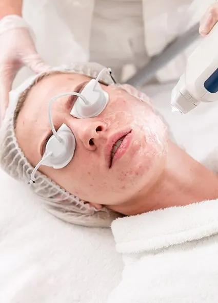Woman getting acne treatment