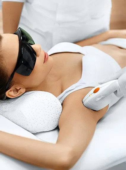 Woman getting laser hair treatment